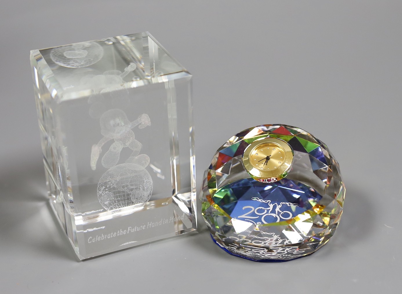 Walt Disney World limited edition crystal cube, 2000 and a Disney 2000 crystal timepiece, both boxed